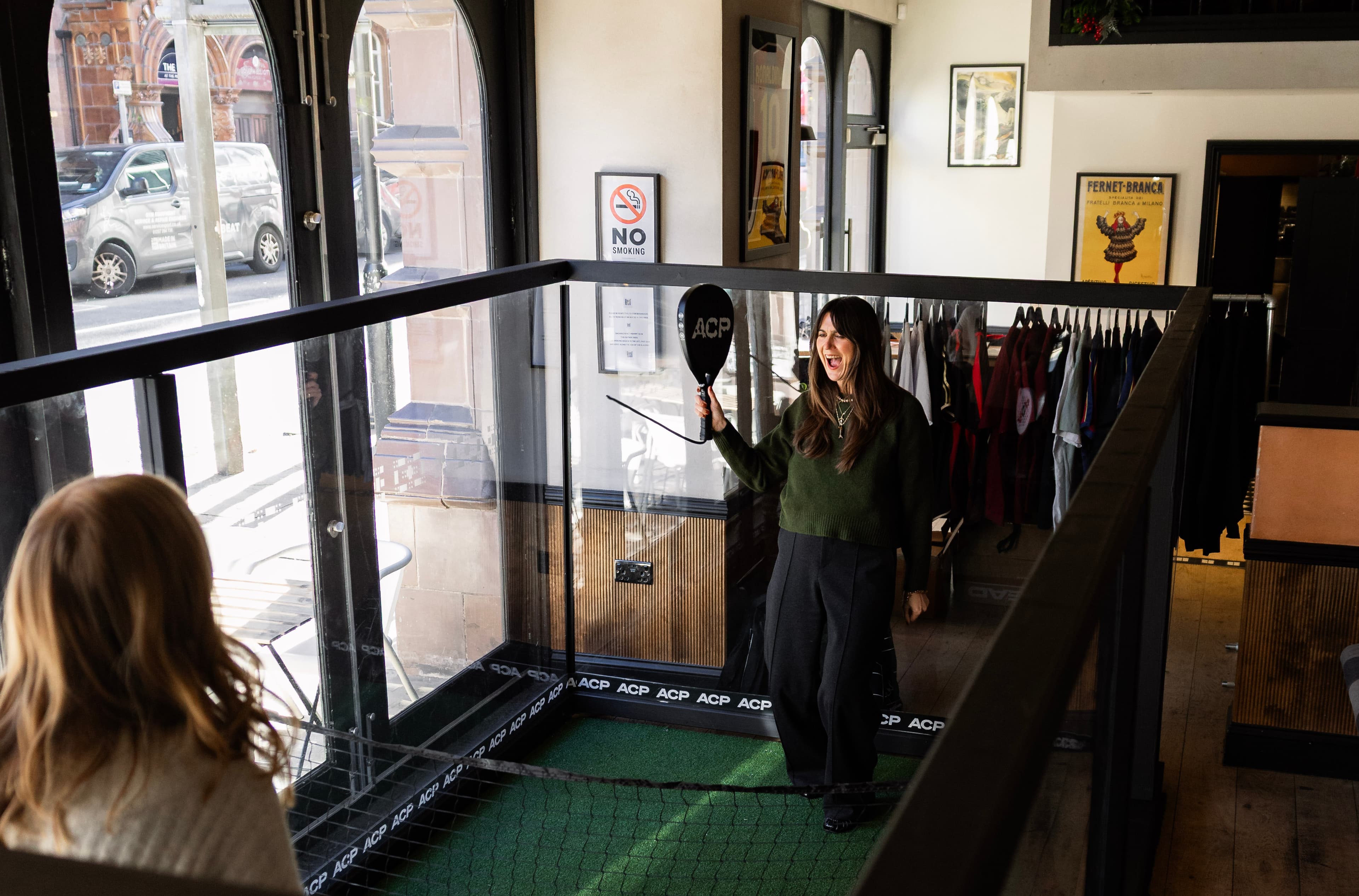 Close-up action shot of two players rallying at the Haunt activation